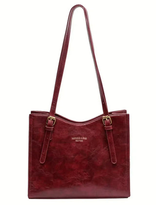 Sac à main compact et élégant Nora, porté en situation – Valloro Paris